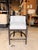 Contemporary barrel-style counter stool featuring sky blue leather upholstery framed by a rich onyx wood finish for a...