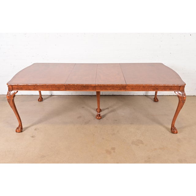 A gorgeous antique Chippendale style dining table By Romweber USA, Circa 1920s Stunning exotic burl wood, with carved...