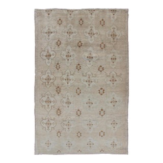 Muted Oushak Hand Knotted With All-Over Tribal Design in Light Tones of Taupe and Browns For Sale