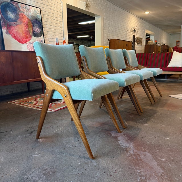 A rare set of four vintage 1950s Beresford & Hicks dining chairs with sculpted wood "scissor" frames and newly upholstered...