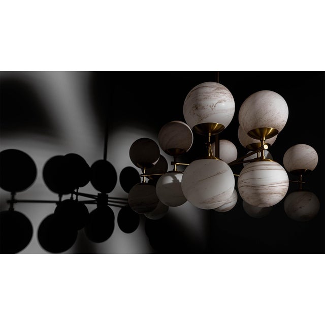 An ornamental simplicity undulates in this shape-shifting form. Globes are mirrored to create a stellar light in this...