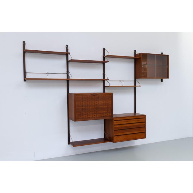 Danish Modular Royal Teak Wall Unit by Poul Cadovius for Cado, 1950s. Mid-Century Modern 4 bay shelving system model...
