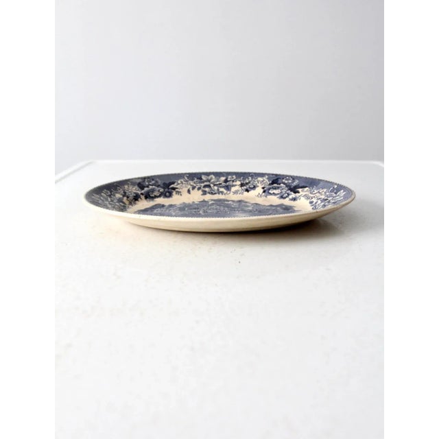 A lovely vintage ironstone serving platter by Thomas Hughes & Son, circa 1930. This piece showcases the “Avon Cottage”...