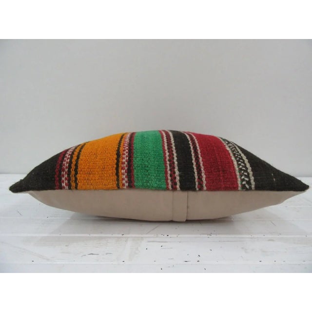 This is a pillow cover made from a vintage kilim rug. The piece was properly washed and ready to use. Pillow inserts not...