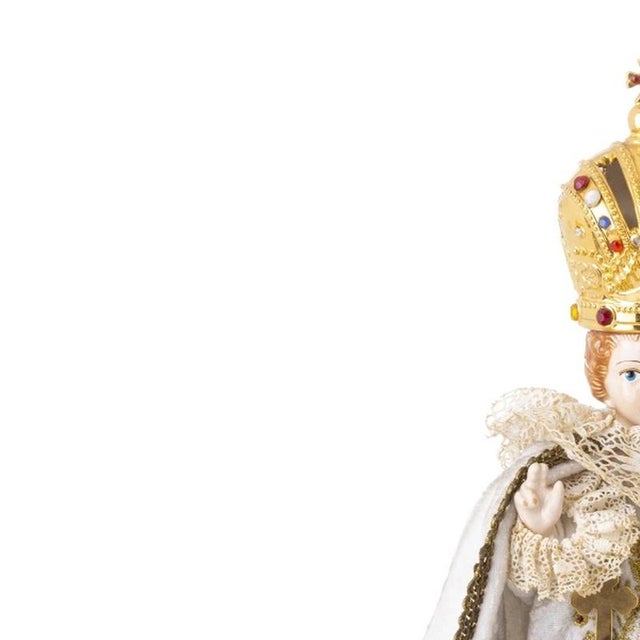 Sacred Art - Infant Jesus of Prague. 20th-century Portuguese sculpture; in polychrome porcelain with fabric garments. The...