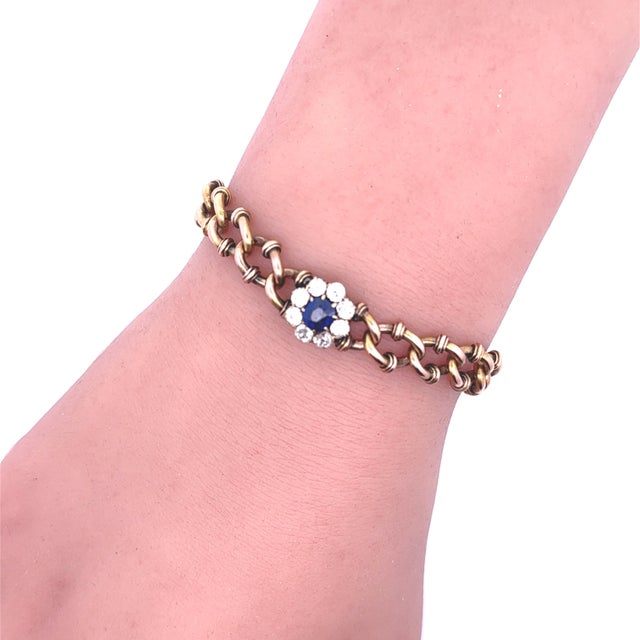 A Victorian link bracelet from the late 1800s, featuring a captivating combination of blue sapphire and white diamonds....
