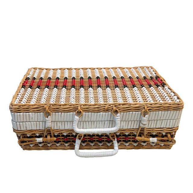 A charming vintage mid-century wicker picnic basket or suitcase-style hamper, dating to approximately the 1950s or 1960s....
