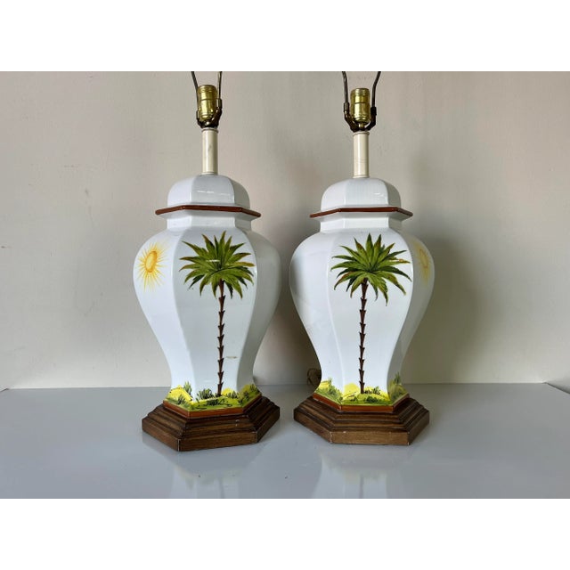 Stunning pair of Palm Beach Hollywood Regency white glazed ceramic table lamps. These glamorous ginger jar form lamps are...