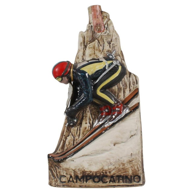 Rare bottle - hand-crafted and painted ceramic advertising sculpture, depicting a skier on a mountain peak. Brandy -...