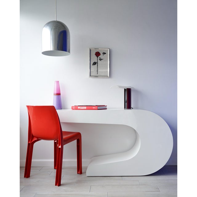 Vintage circa 1990s console table or desk in the style of Pierre Cardin. White laminate over wood base in a sculptural C...