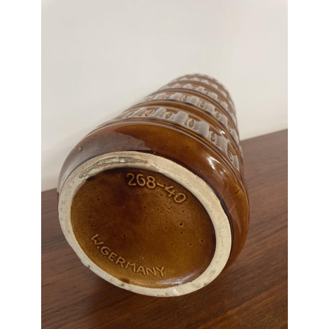 This large sculptural West German ceramic vase dates from the 1960s and exemplifies the bold forms and textured surfaces...