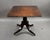 A handsome Regency mahogany breakfast table, featuring a rectangular tilt-top with rounded corners and a moulded edge. The...
