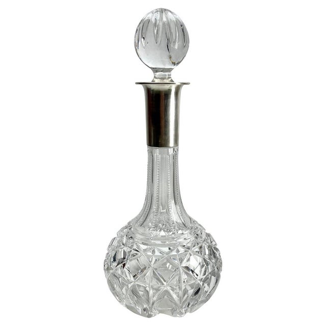 Elegant Large Cut Crystal Decanter with Silver Mounting This exquisite large cut crystal decanter with silver mounting...