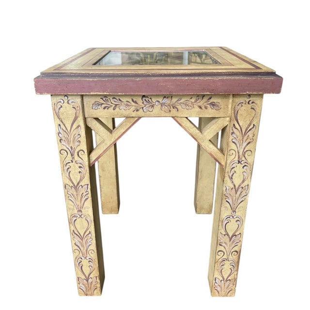 This charming vintage side table features an elegant, architectural silhouette with a distinctive geometric fretwork...