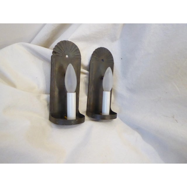 Early 20th century darkened, weathered brass sconces with updated wiring, use up to 60 watt candelabra base bulbs.