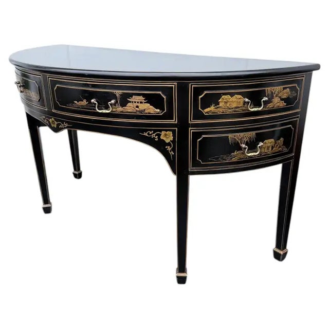 Large six-drawer Chinoiserie demilune server featuring a gloss black finish with hand painted gilt Asian scenes. This...