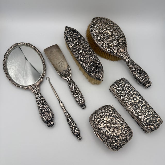 For sale is a rare seven-piece vanity set by Tiffany & Co., crafted from solid sterling silver. The pieces feature a rich...