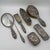 For sale is a rare seven-piece vanity set by Tiffany & Co., crafted from solid sterling silver. The pieces feature a rich...