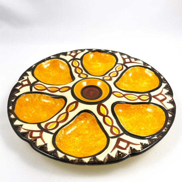 French faïence hand painted oyster plate by Henriot Quimper, circa 1970's. Signed on reverse: "HB Quimper RI, F 406, D261"...