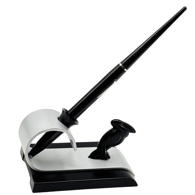 Original streamlined Art Deco fountain pen holder with a sculptural pelican paired with a sleek, curved silver-tone metal...