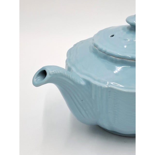 There are no markings on this teapot, but a search shows it as a Hall Birch Light Blue Teapot in the Darby Pattern, which...