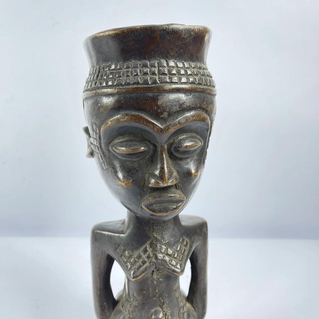 The Kuba people of the Democratic Republic of the Congo are renowned for their intricate figurative carvings, notably seen...