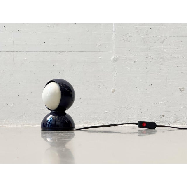 The iconic eclisse table lamp, designed in 1965 by vico magistretti for artemide, exemplifies italian space age design of...