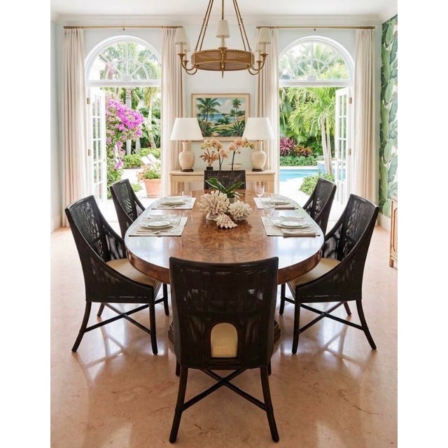 6 McGuire, dining chairs by Barbara Barry in tobacco black with a tan linen upholstery. Quality construction with...