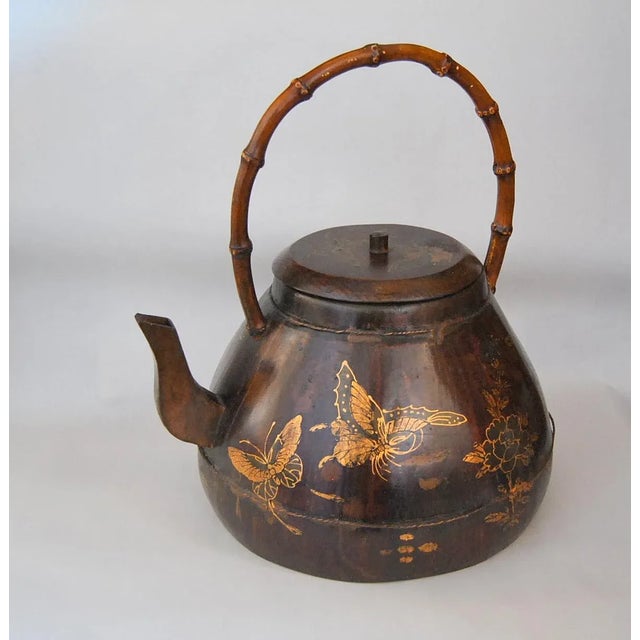 A Rare Antique Rosewood Gild Water Kettle or Teapot With Butterflies and Flowers circa late 19th Century. The bulbous...