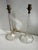 A matching pair of vintage clear glass table lamps with geometric faceted columns and flared round base. 17.75” height to...