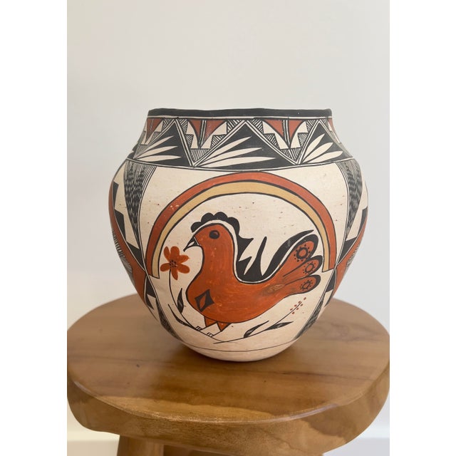 This beautiful, substantial pot by Acoma Pueblo artist Lydia H Ray features a traditional bird design and intricate line...