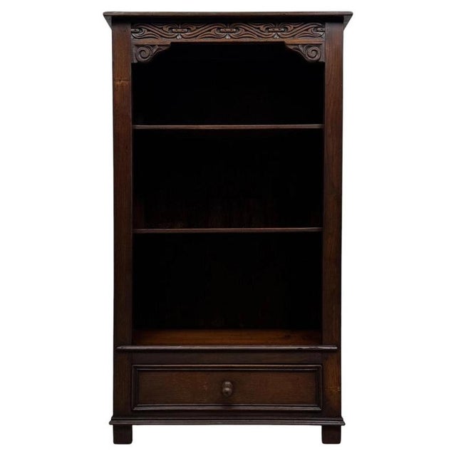 A charming and well-crafted early 20th-century English open bookcase, beautifully constructed in oak and distinguished by...