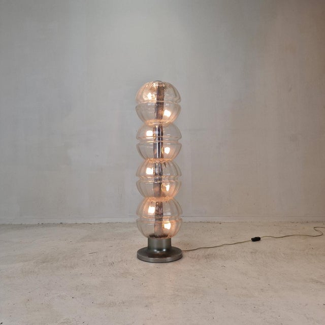 The present light is very rare and well preserved floor lamp, designed in the 1980's in Italy. Realized in four elements...