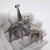 A delightful and characterful duo, this vintage Italian miniature set features two finely crafted giraffes, captured with...