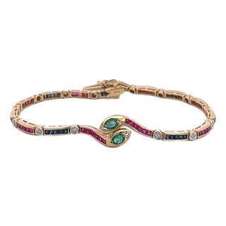 Vintage Yellow Gold Snake Bracelet With Emeralds, Rubies, and Diamonds For Sale