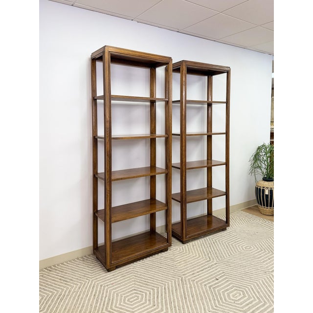 This handsome pair of vintage Drexel mid-century modern transitional bookcases are a well-made and versatile storage find....