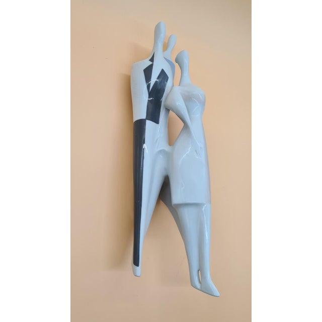 This Royal Dux Bohemia wall figurine from the 1950s, made of shiny porcelain, represents the modernist, so-called Brussels...