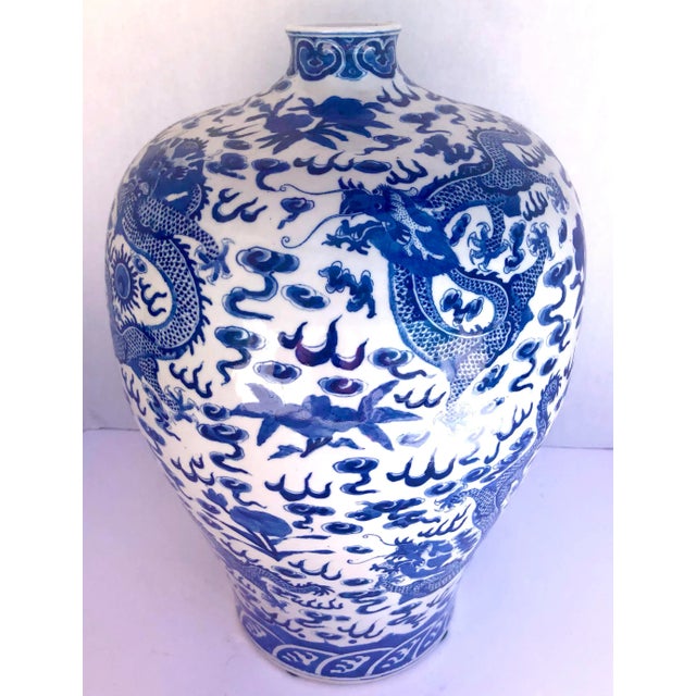Fabulous large Chinese dragon Blue and White Ceramic Urn. Nicely marked at the bottom and also remaining, part of a paper...