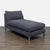 This CB2 chaise lounge offers a modern look with its clean lines and dark gray upholstery. It features a plush cushion and...