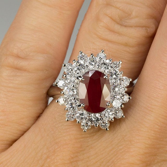 Platinum Ring with AGL certified Burma Ruby weighing 3.03 carats and 24 round brilliant diamonds weighing 2.26. 12.55...