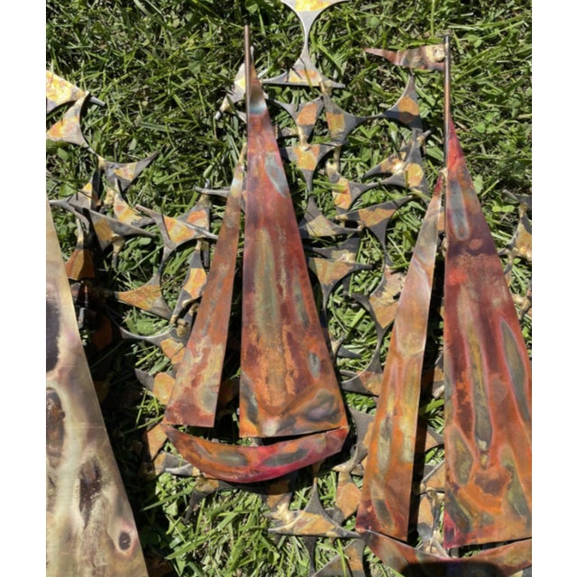 A vintage Mid-Century modern American wall sculpture made of handcrafted metal, designed and produced by Marc Weinstein...
