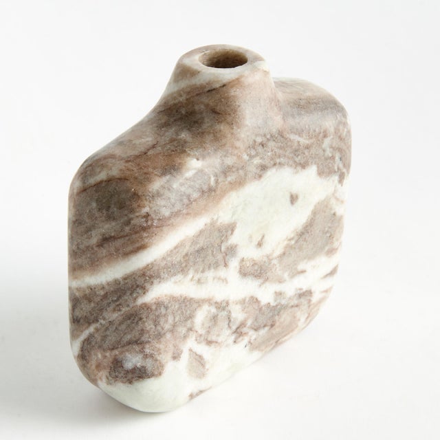 Honed to a semimatte finish, this stunning marble is specifically known for its unique darkBrown to lightBrown broad...