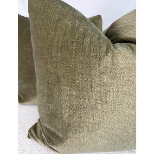 Custom pair of 22" pillows covered in Kirby Design "Orion III Velvet" in color willow, an olive green. These pillows have...