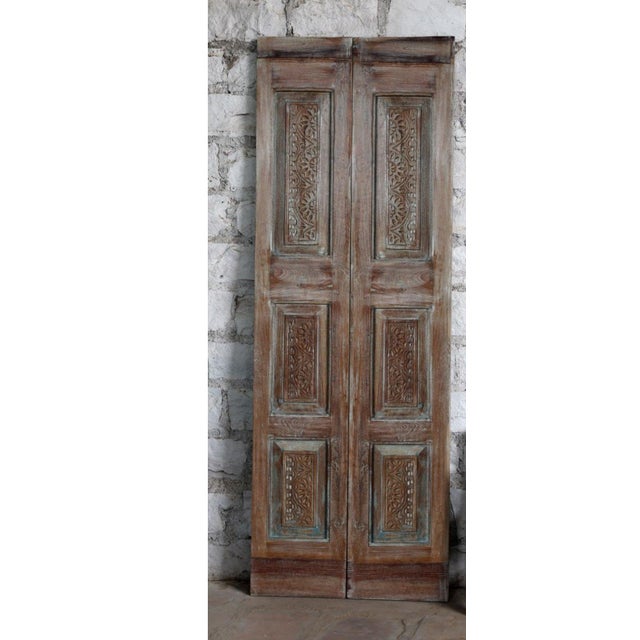 An authentic antique carved door blending rustic farmhouse warmth with timeless French country elegance. Hand-carved...