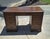 This Sligh-Lowry double-pedestal kneehole desk was crafted by the renowned Sligh Furniture Co. in Holland, Michigan,...