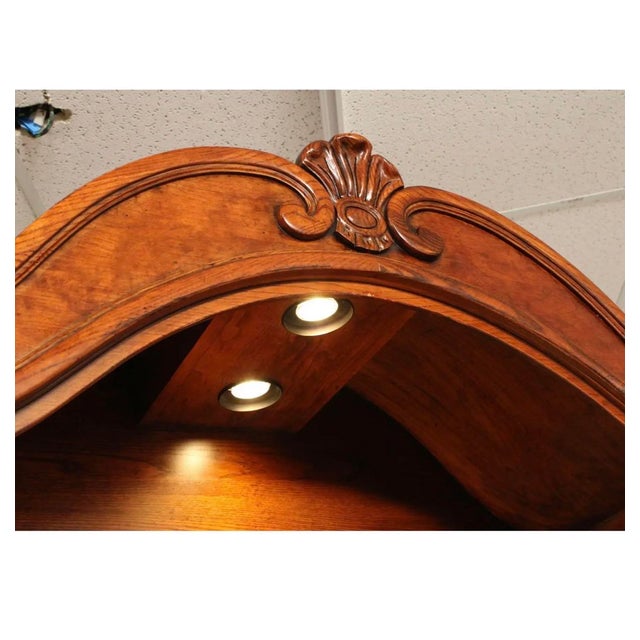 Elegant high quality American made carved wood frame illuminated display cabinet with mirrored back adjustable glass...