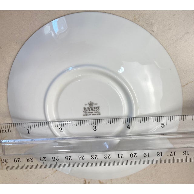 Elegant traditional English tea cup and saucer. Fine bone china with English garden florals and gold trim. Saucer measures...