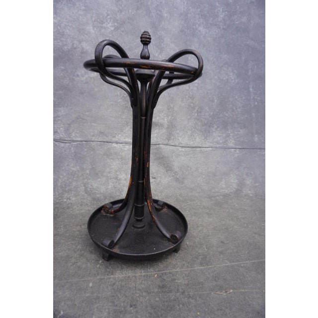 A rare original Thonet umbrella stand, painted in a rich, deep black. Subtle patina throughout reveals hints of the...