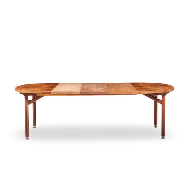 Jens Risom Mid Century Walnut Round Expanding Dining Table with 3 Leaves This table measures: 48 wide x 48 deep x 28.5...