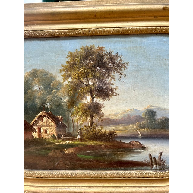 A charming pair of 19th-century French landscape oil paintings acquired in France, each depicting tranquil pastoral scenes...